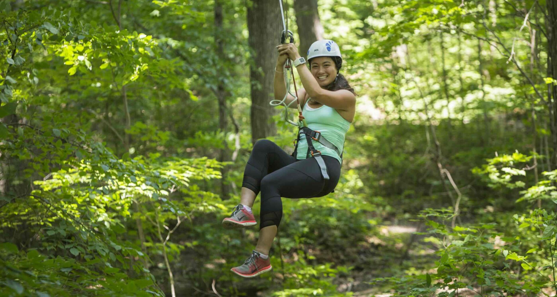 TREETOP TREKKING Huntsville Ontario girl on zipline